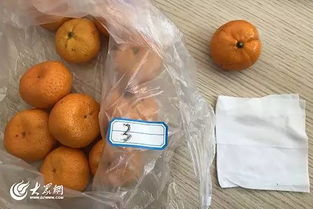 湿巾擦拭沙糖橘掉色引担忧，记者调查 合格产品仍可食用